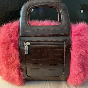 Faux purse in the color pink and dark brown.